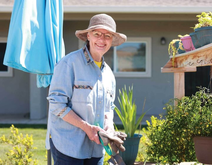 A Bethany resident gardening outside her home