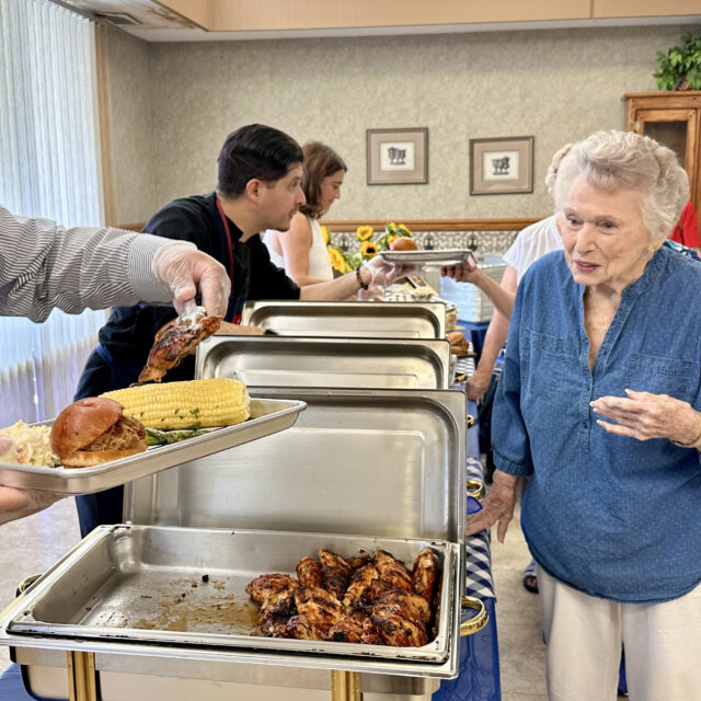 Serving a meal at a Bethany event