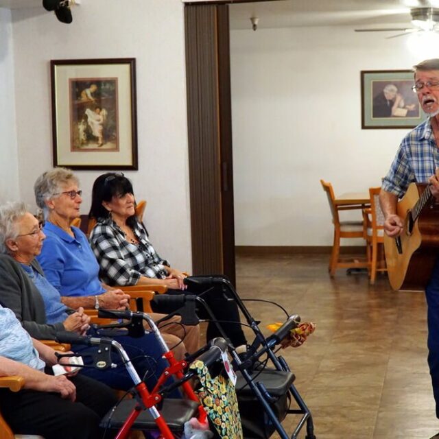 Playing guitar for Bethany residents